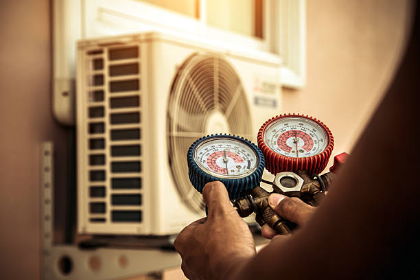 Professional Air Conditioning Service technician working in Winthrop, MA
